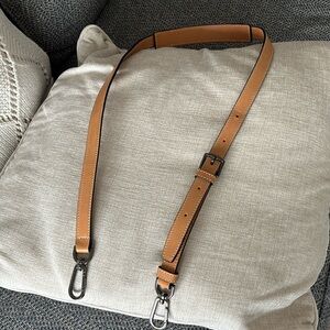 Tumi tan leather strap..